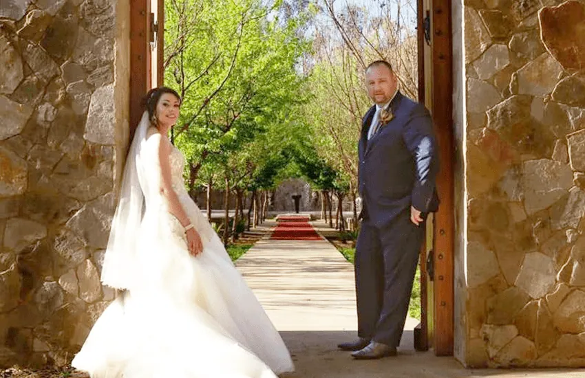 A bride at the stone entrance to the Forest Chapel at Usambara Venue