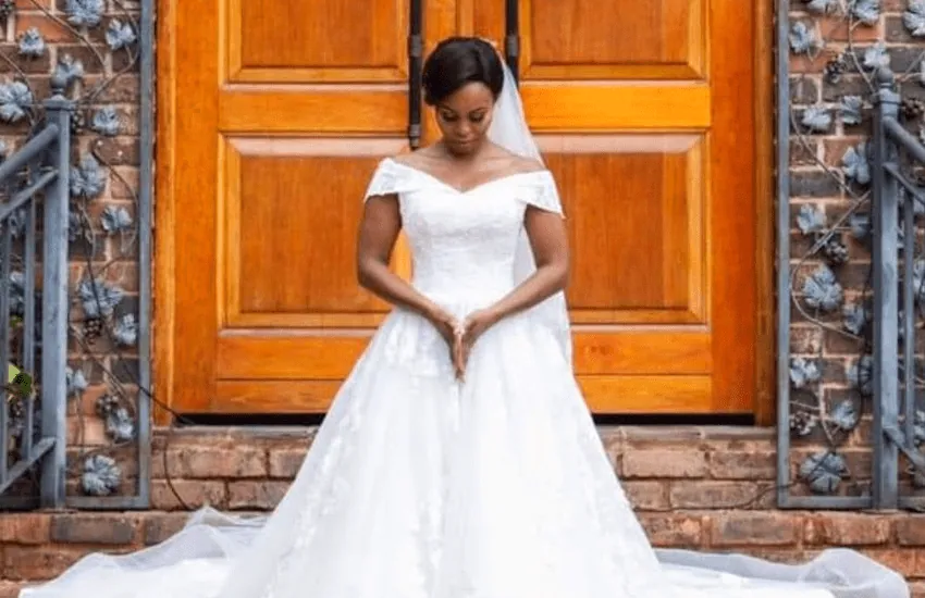 A bride outside the timber doors of the Formal Chapel at Usambara Venue