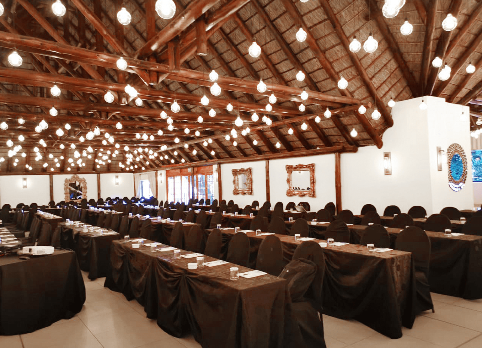 A large conference hall in classroom layout at Usambara Venue