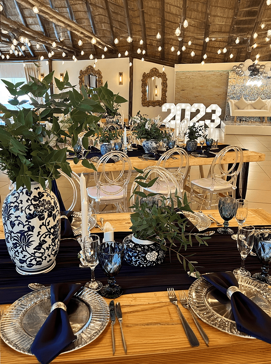 A styled table with tall floral arrangements at Usambara Venue