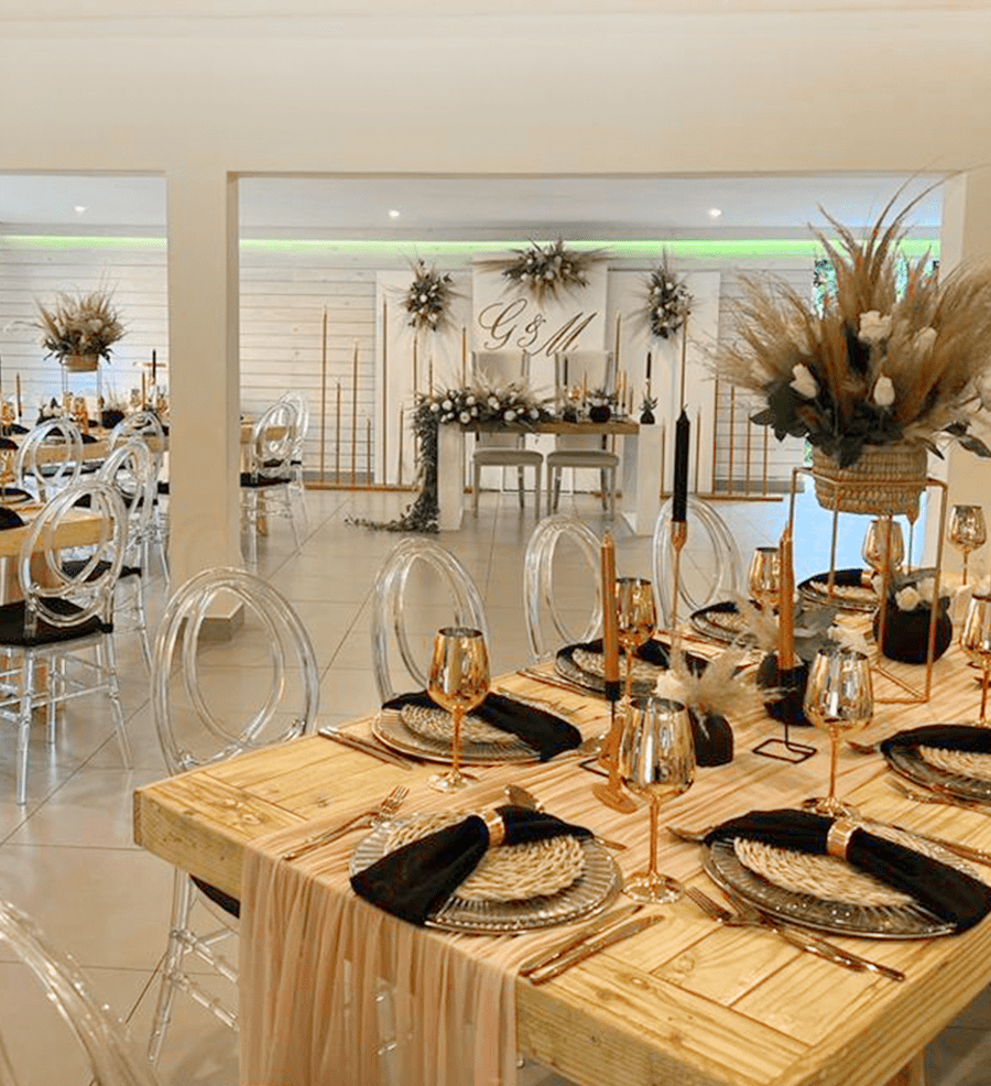 The Mabweni venue at Usambara Venue dressed with wooden tables and pampas grass
