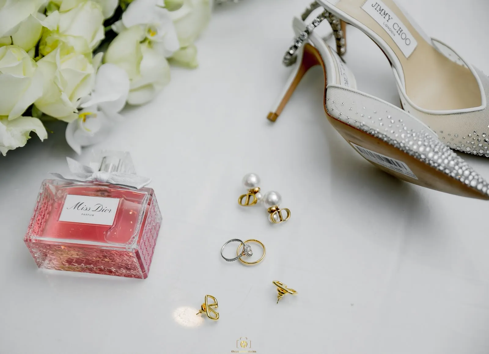 Wedding details: bridal shoes, perfume and rings
